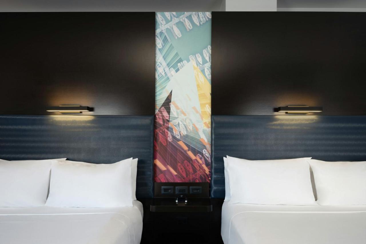 Splash Double Queen with 2 Queen Beds - Poolside view at Aloft by Marriott Sarasota