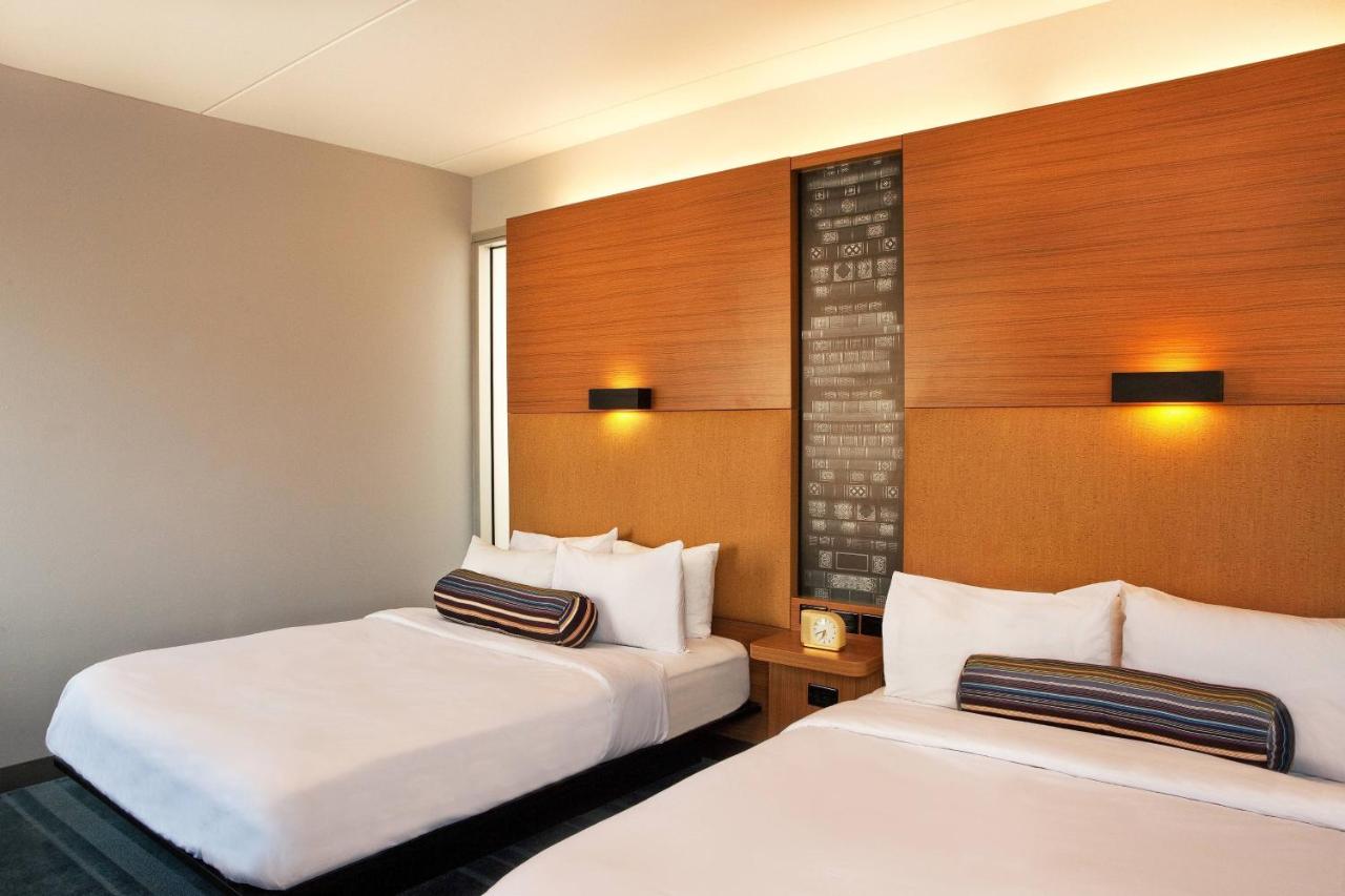 Queen Room with Two Queen Beds and Roll-in Shower - Mobility and Hearing Accessible at Aloft by Marriott Chesapeake