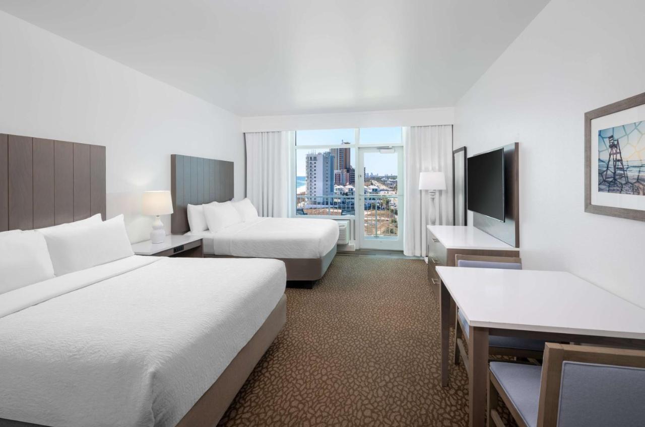 Corner Queen Room with Two Queen Beds and Beach View at Best Western Premier The Tides