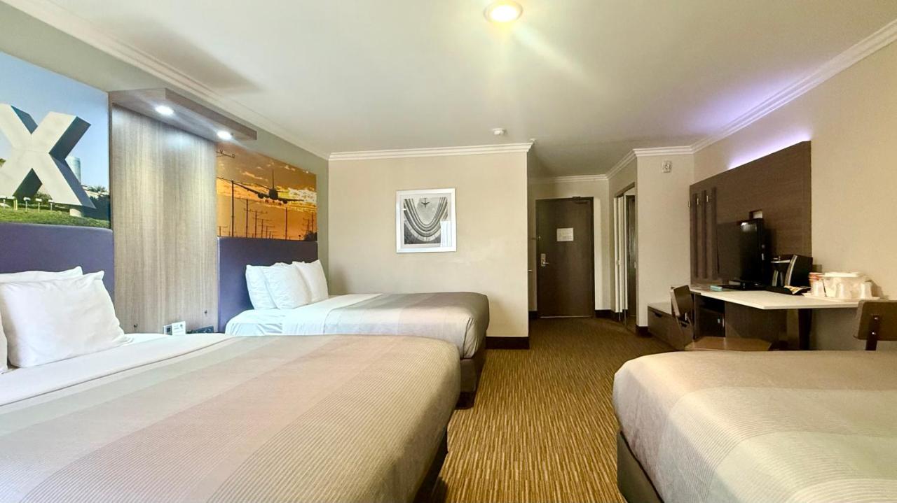 Family Room, 3 Queen Beds, Accessible Tub, Non Smoking at Quality Inn & Suites Los Angeles Airport - Stadium District