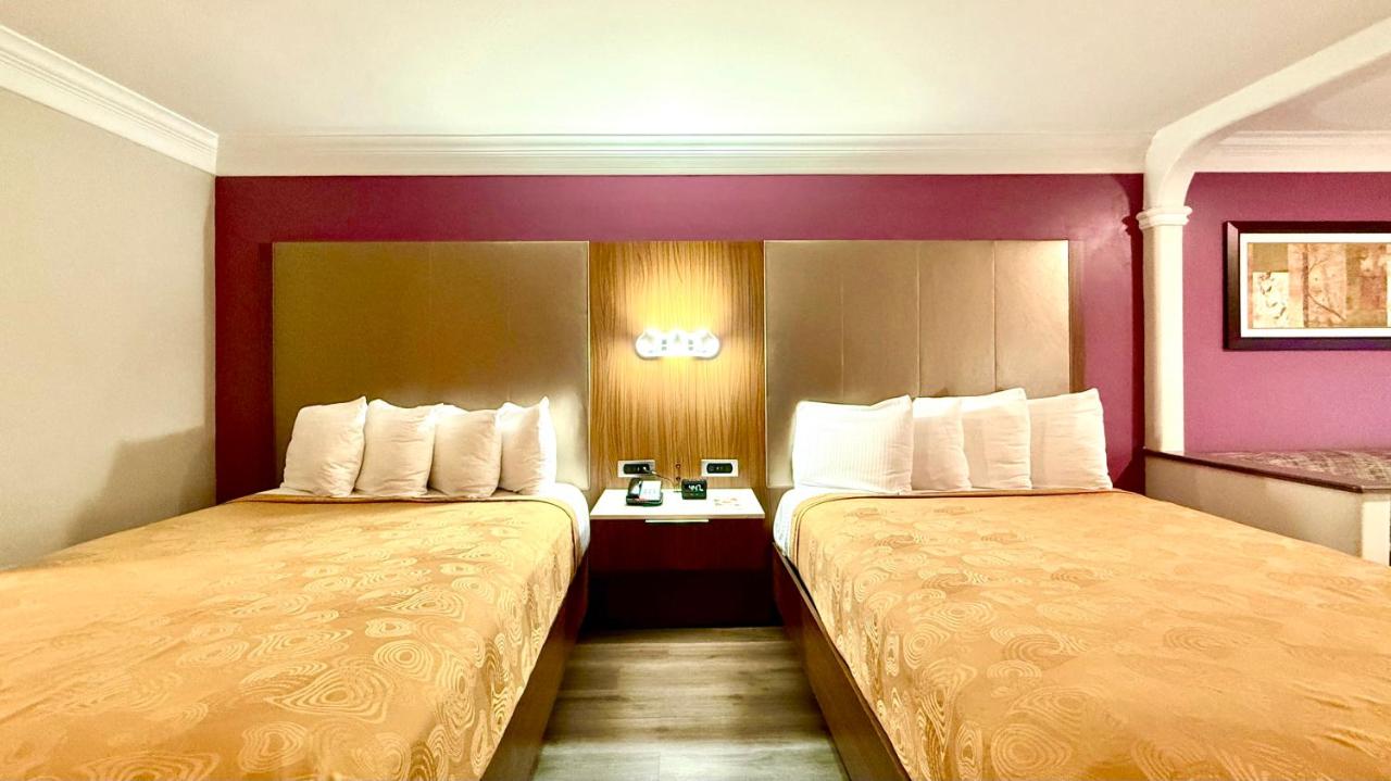 Queen Room with Two Queen Beds and Sofa Bed - Non-Smoking at Best Western Plus Suites Hotel - LAX Airport LA Stadium