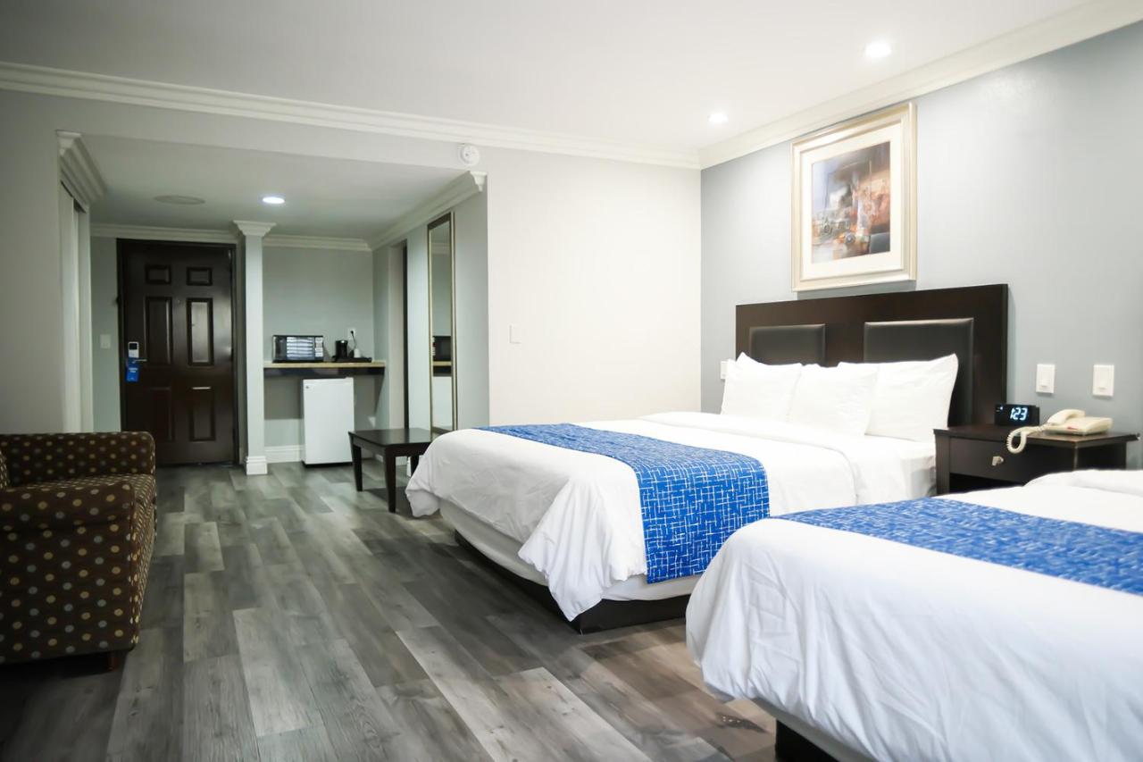 King Room with Two King Beds - Smoking at Days Inn by Wyndham West Covina