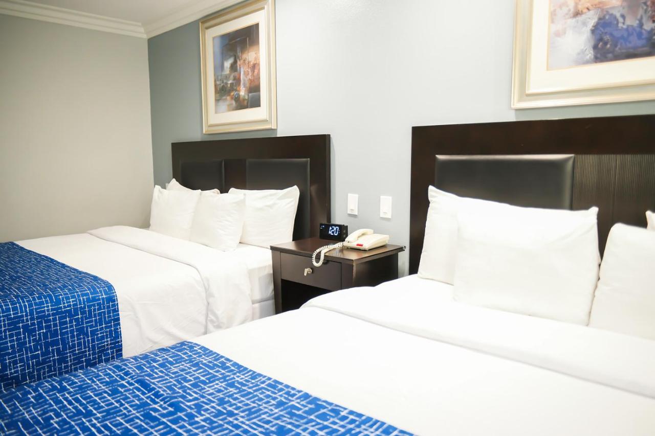 King Room with Two King Beds - Smoking at Days Inn by Wyndham West Covina