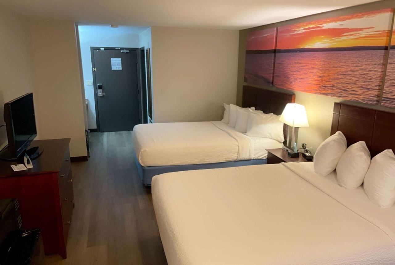 Queen Room with Two Queen Beds - Non-Smoking at Days Inn & Suites by Wyndham Stevens Point
