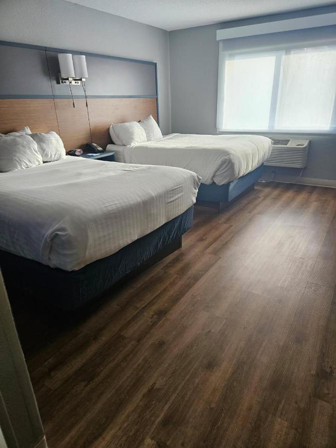 Queen Room with Two Queen Beds - Non-Smoking at AmericInn by Wyndham Albert Lea
