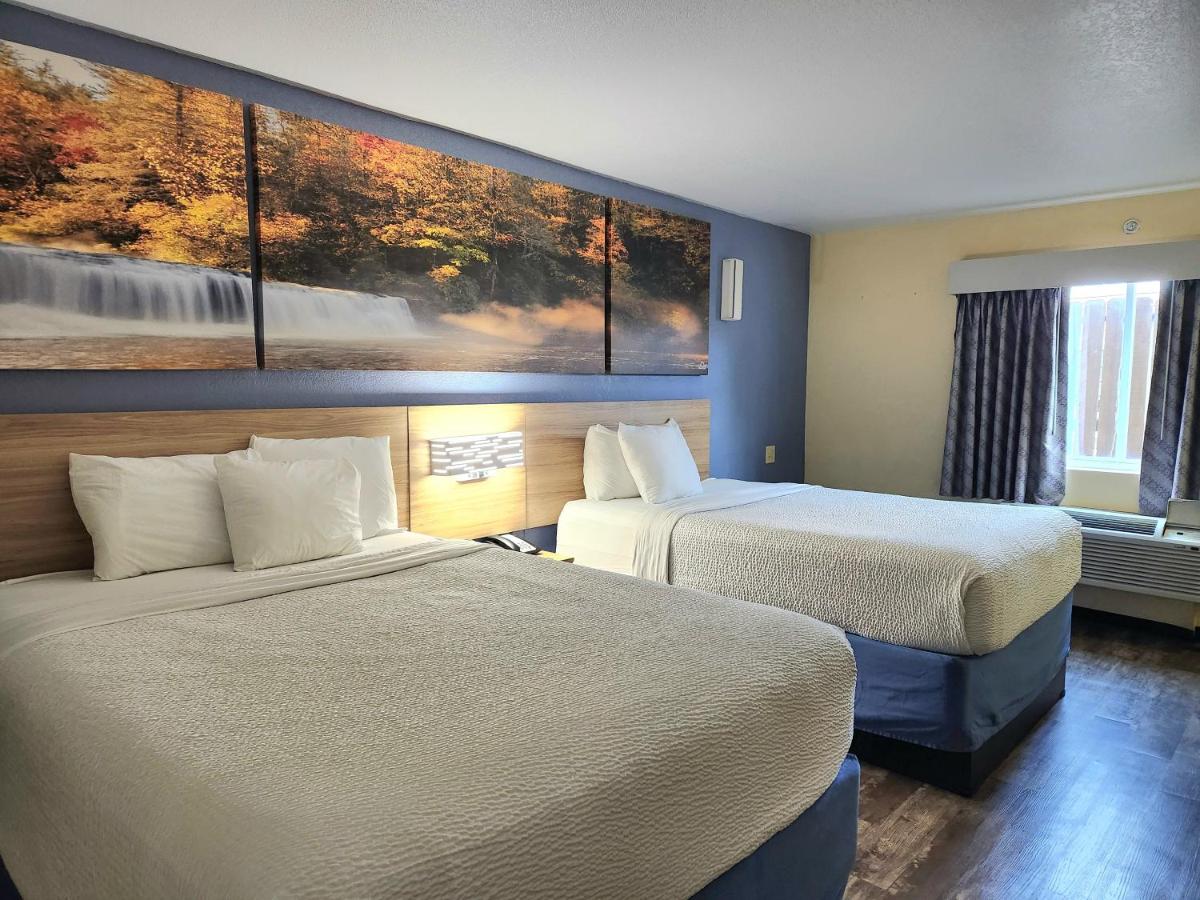 Queen Room with Two Queen Beds and Kitchenette - Non-Smoking at Days Inn by Wyndham New Orleans Pontchartrain
