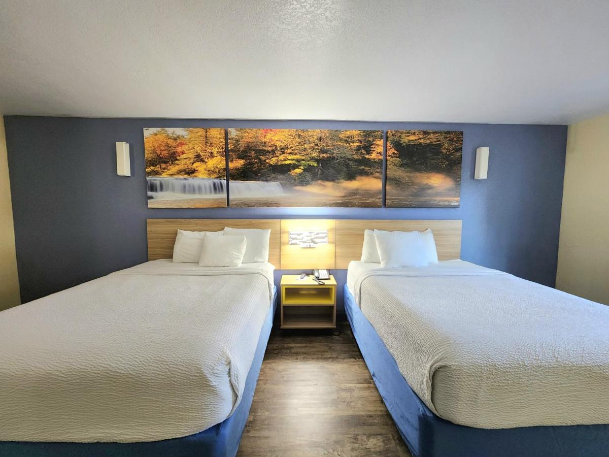 Queen Room with Two Queen Beds and Kitchenette - Non-Smoking at Days Inn by Wyndham New Orleans Pontchartrain