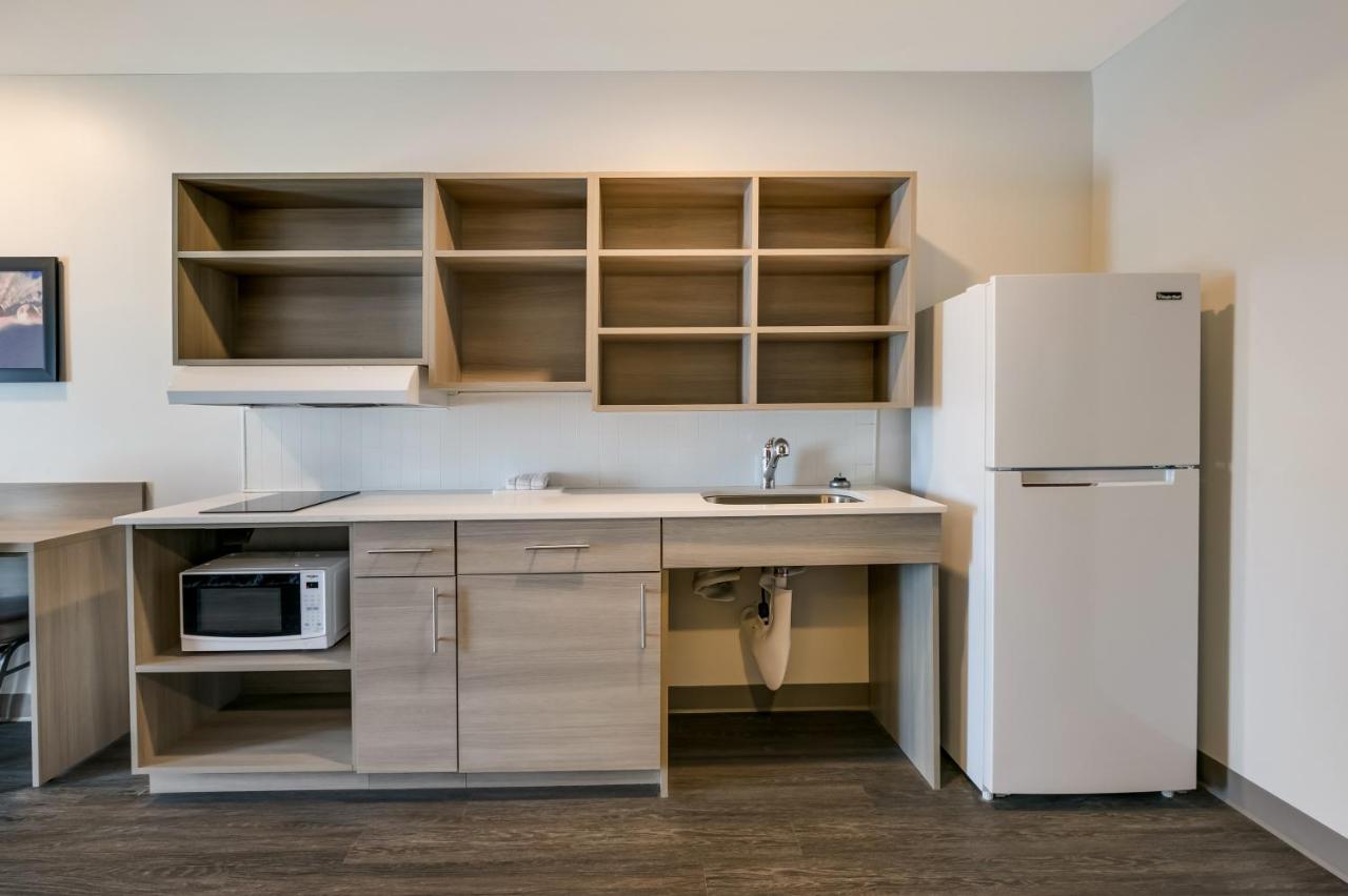 Queen Room with Sofa - Disability Access/Non-Smoking at WoodSpring Suites Concord-Charlotte Speedway
