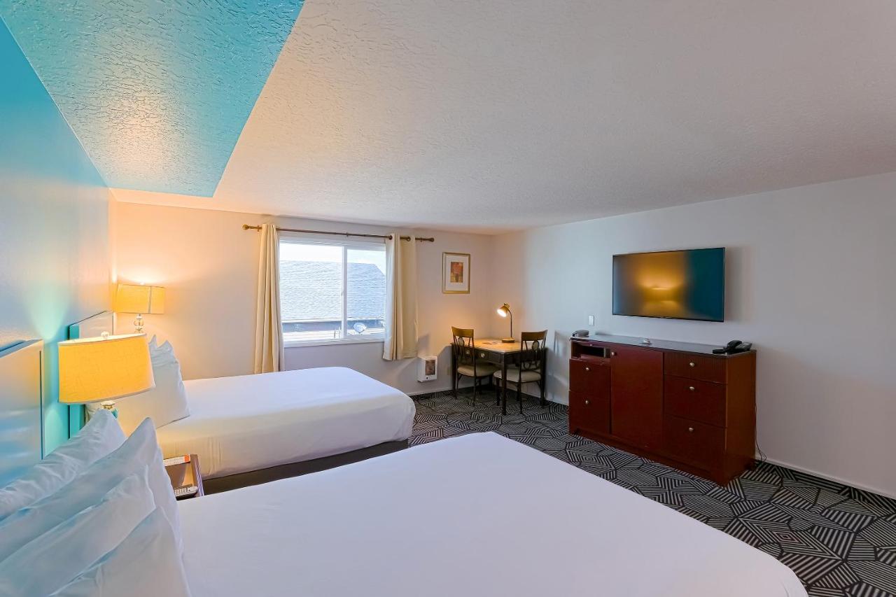 Queen Room with Two Queen Beds at Coast River Inn by OYO Seaside