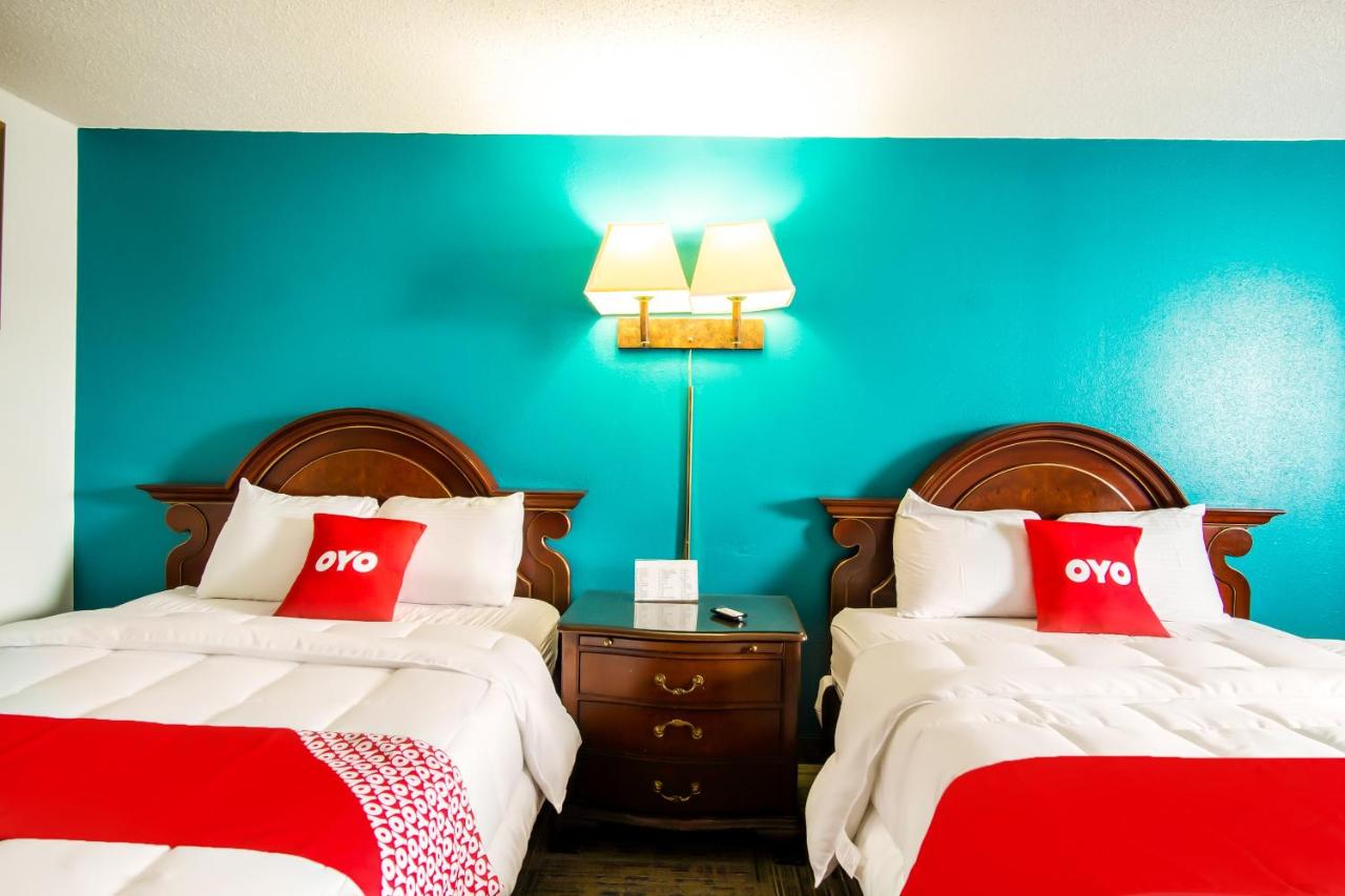 Queen Room with Two Queen Beds at OYO Hotel Hutchinson KS West 4th Ave