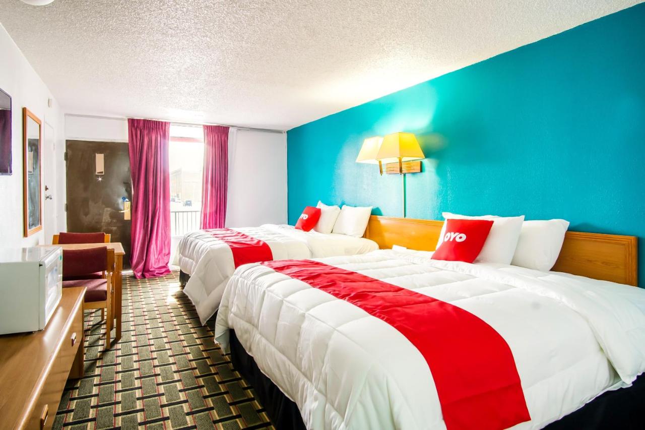 King Room with Two King Beds at OYO Hotel Hutchinson KS West 4th Ave