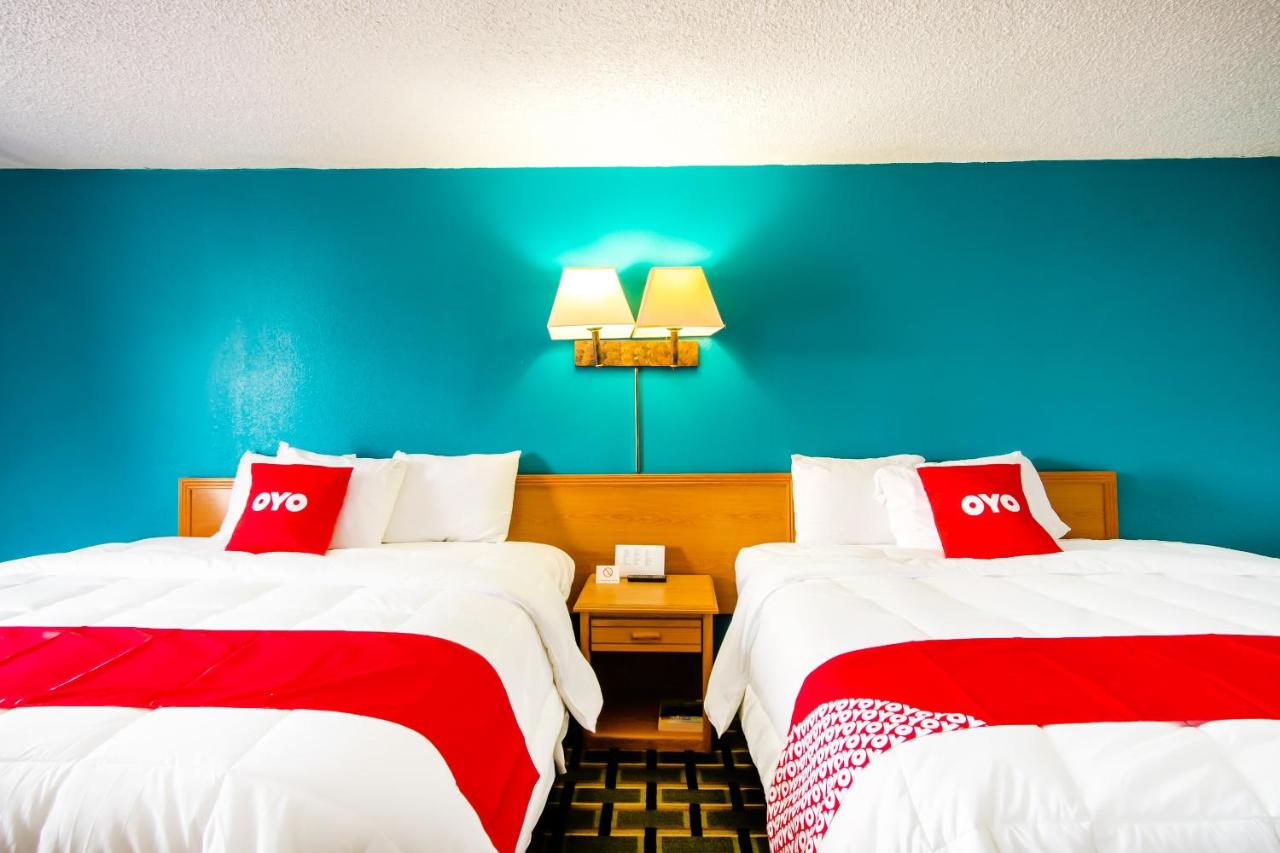 King Room with Two King Beds at OYO Hotel Hutchinson KS West 4th Ave