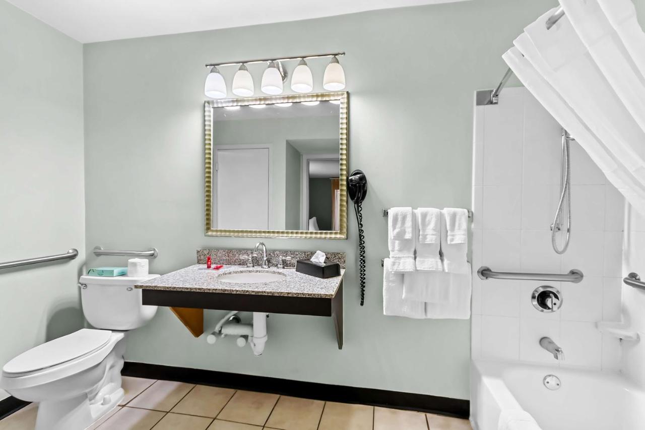 Suite with Mobility Accessible Roll-In Shower at SureStay Studio by Best Western Pensacola