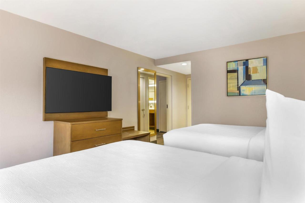 Queen Suite with Two Queen Beds and Sofa Bed at Best Western Plus Raleigh Crabtree Valley Hotel