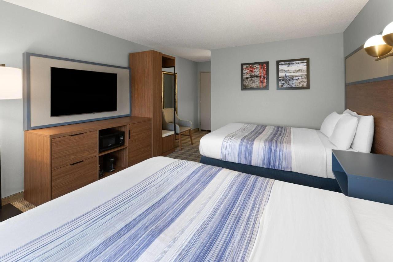 Queen Room with Two Queen Beds - Non-Smoking at AmericInn by Wyndham Chippewa Falls