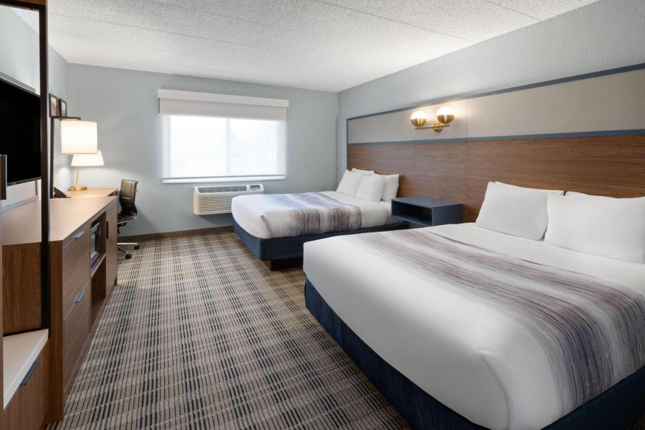 Deluxe Queen Room with Two Queen Beds - Non-Smoking at AmericInn by Wyndham Chippewa Falls