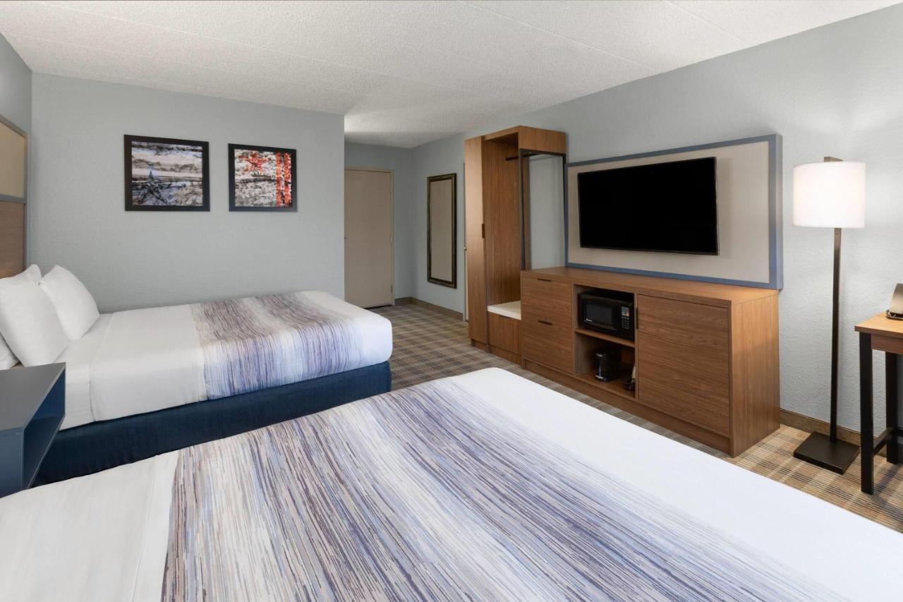 Deluxe Queen Room with Two Queen Beds - Non-Smoking at AmericInn by Wyndham Chippewa Falls