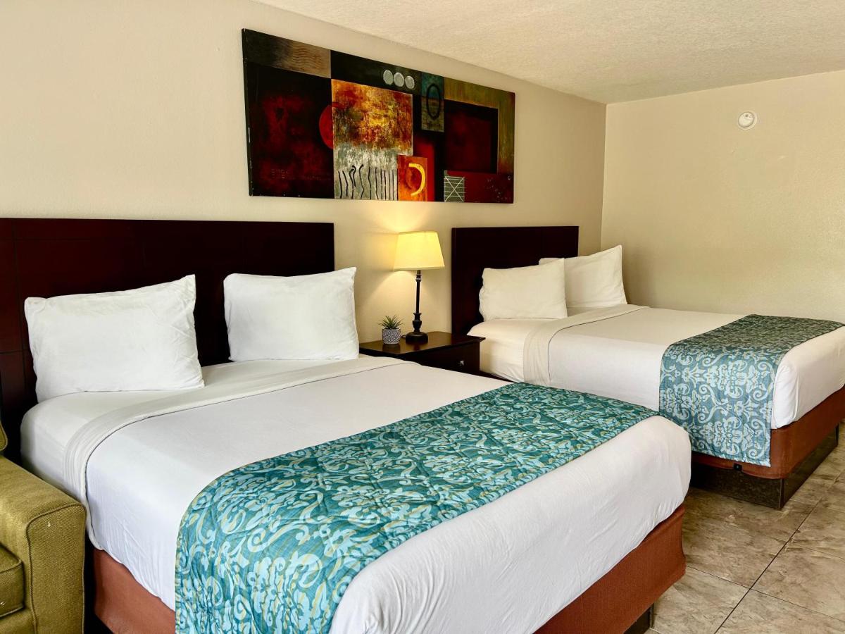 Queen Room with Two Queen Beds at Shining Light Inn & Suites
