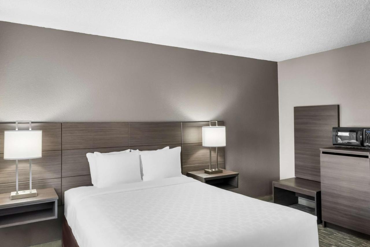 Queen Room with Three Queen Beds at SureStay Hotel by Best Western SeaTac Airport North