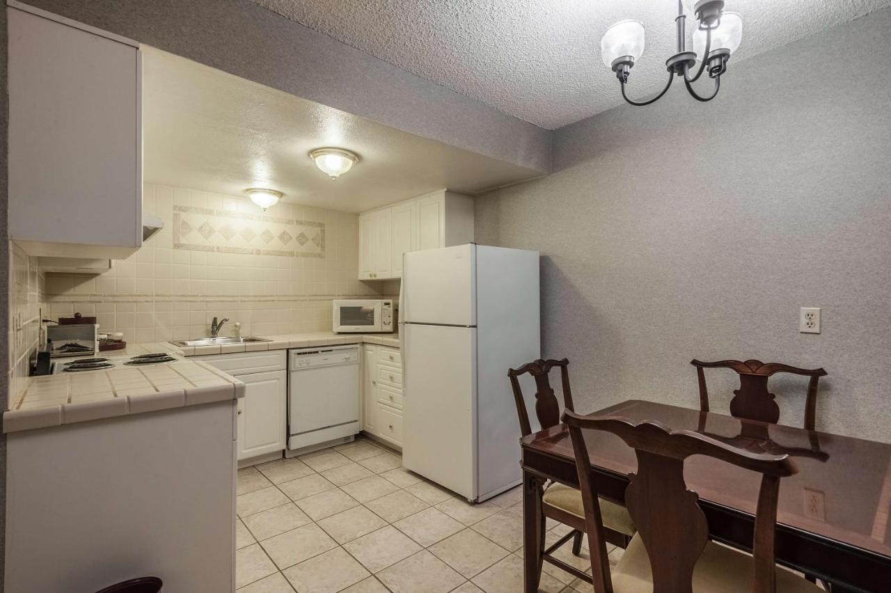 Two-Room King Suite with Jetted Tub at SureStay Hotel by Best Western SeaTac Airport North