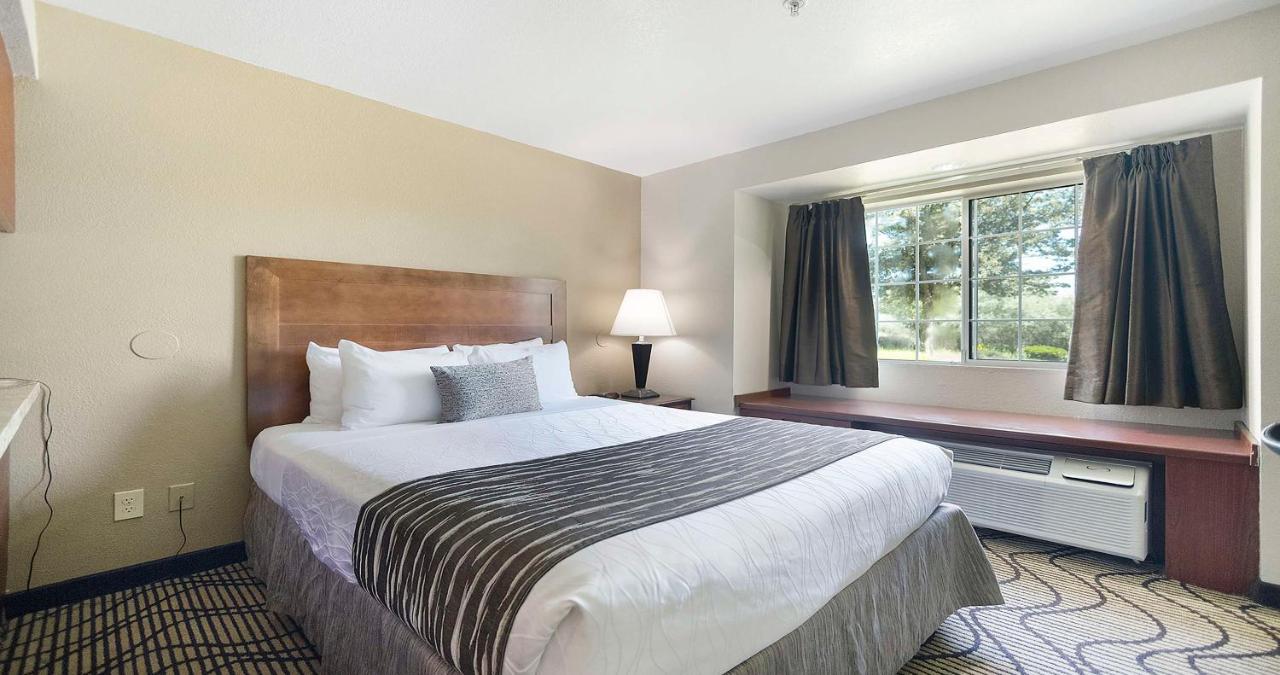 Queen Room with Two Queen Beds and Wet Bar at SureStay Plus Hotel by Best Western Rocklin