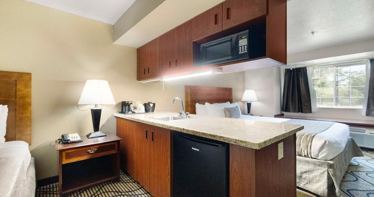 Queen Room with Two Queen Beds and Wet Bar at SureStay Plus Hotel by Best Western Rocklin