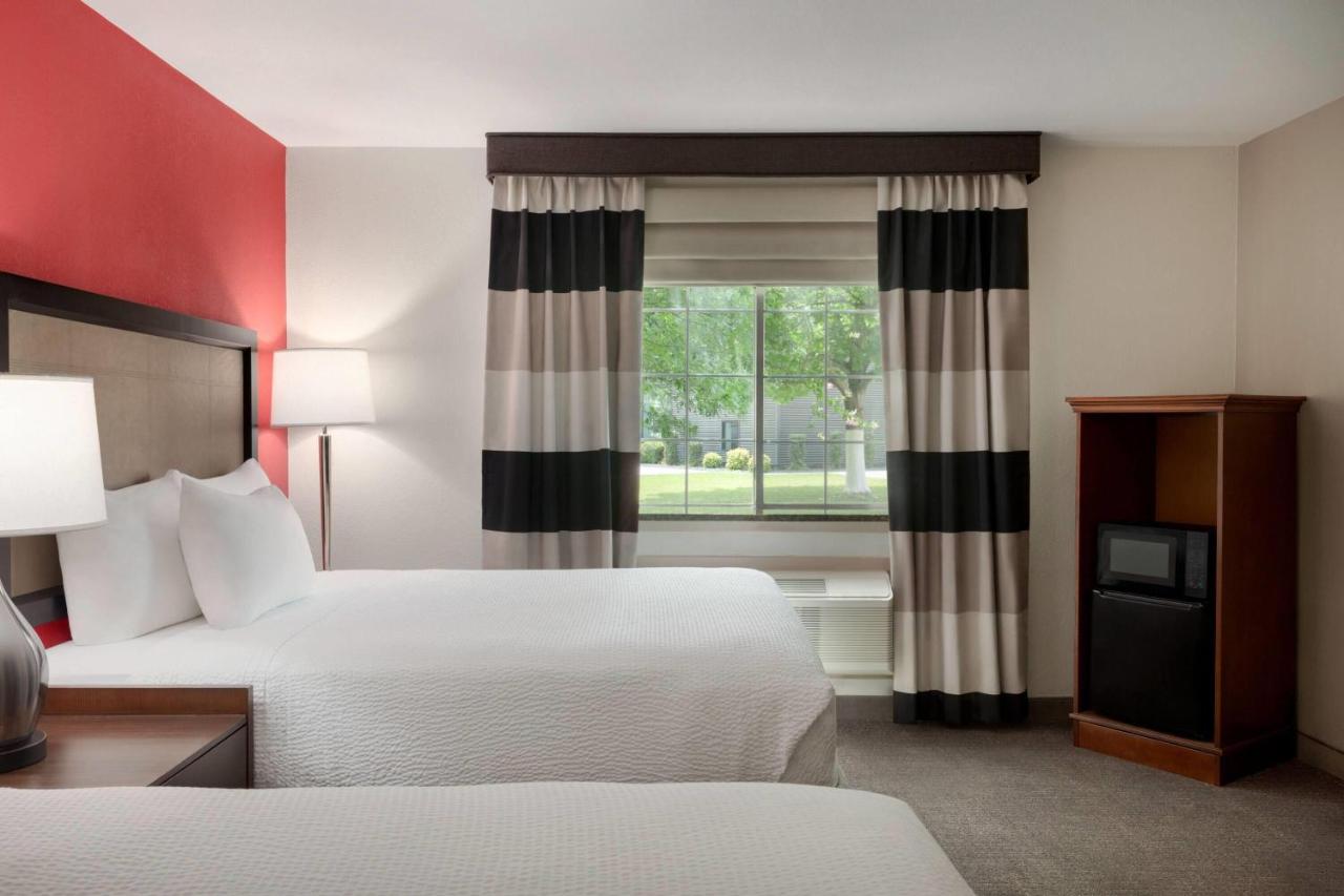 Queen Room with Two Queen Beds and Roll-In Shower - Mobility/Hearing Accessible - Non-Smoking at Ramada by Wyndham Del Rio