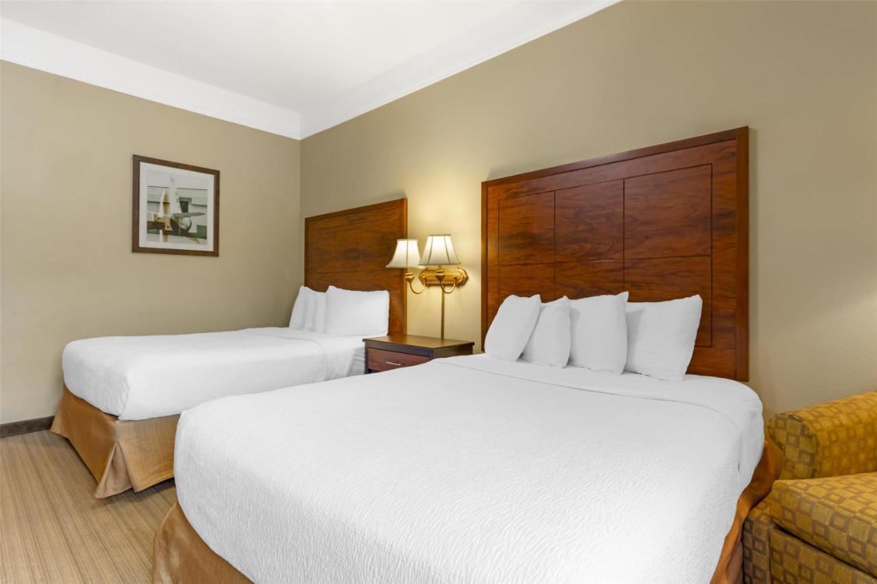 Queen Room with Two Queen Beds with Roll-In Shower at Best Western Plus Monica Royale Inn & Suites