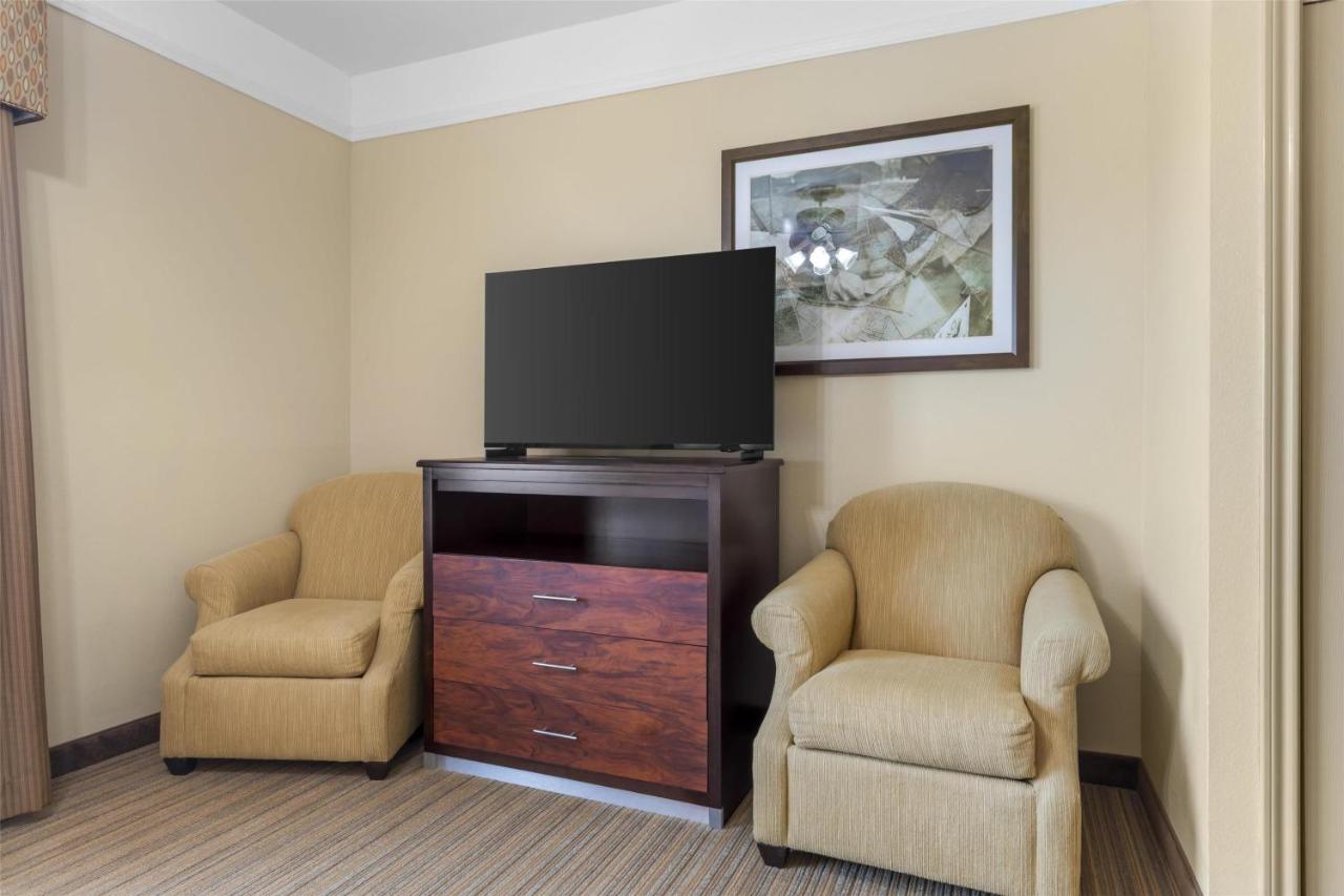 King Suite with Sofa Bed and Mobility Accessible Walk in Shower at Best Western Plus Monica Royale Inn & Suites