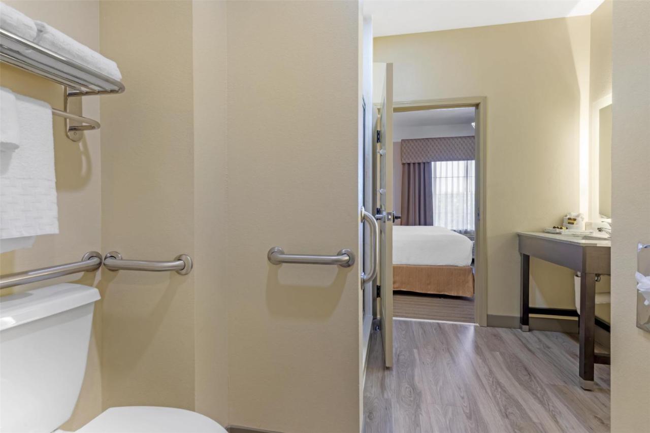 King Suite with Sofa Bed and Mobility Accessible Walk in Shower at Best Western Plus Monica Royale Inn & Suites