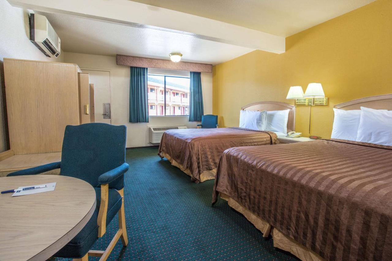 Queen Room with Two Queen Beds and Pool View - Non-Smoking at Travelodge by Wyndham Turlock