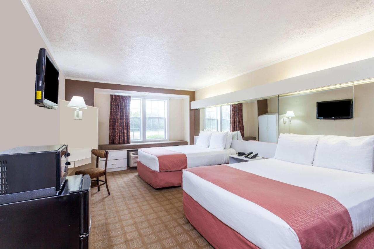Queen Room with Two Queen Beds - Non-Smoking at Microtel Inn by Wyndham Wilson