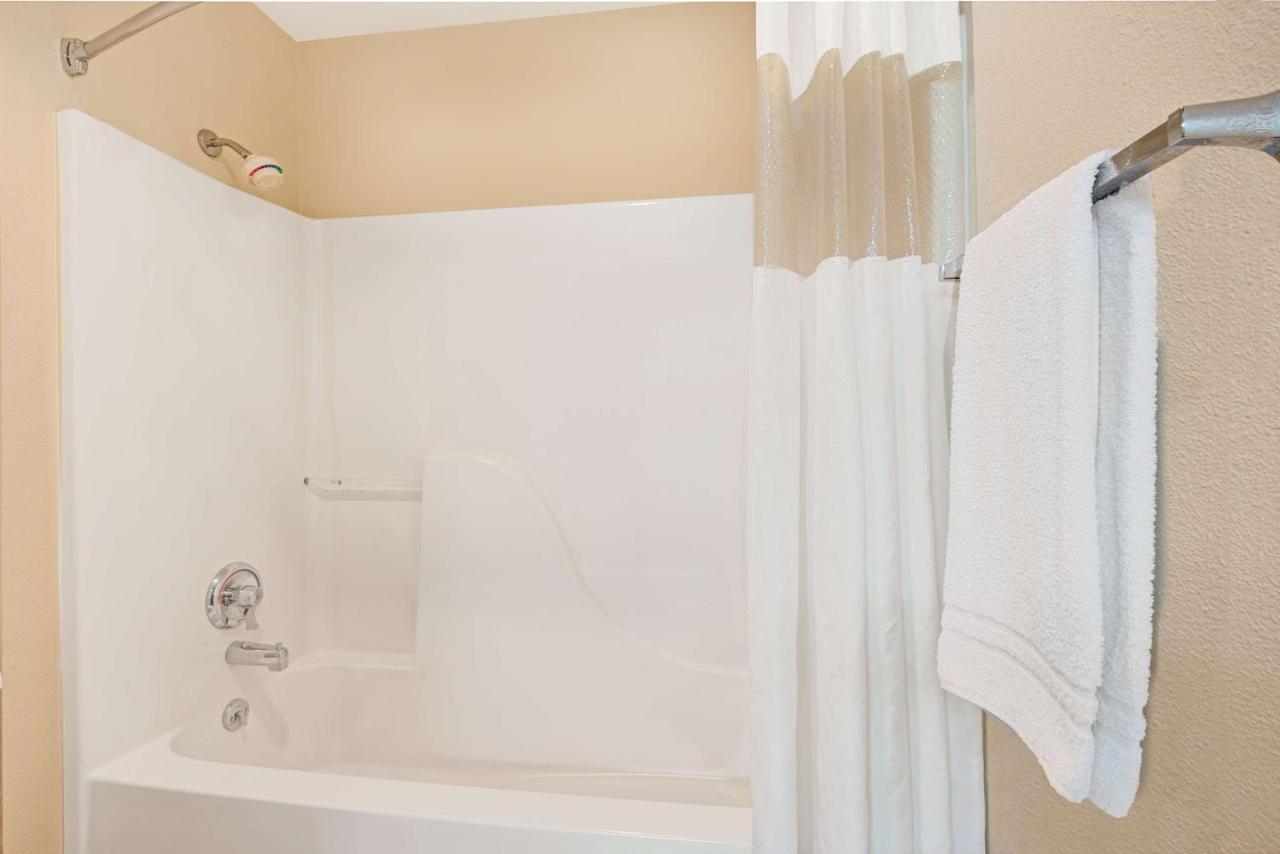 Queen Room with Two Queen Beds - Smoking at Days Inn & Suites by Wyndham Kansas City South
