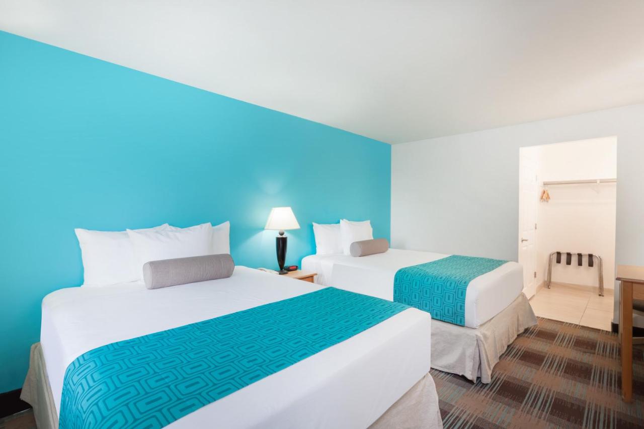 Queen Room with Two Queen Beds at Howard Johnson by Wyndham San Diego Hotel Circle