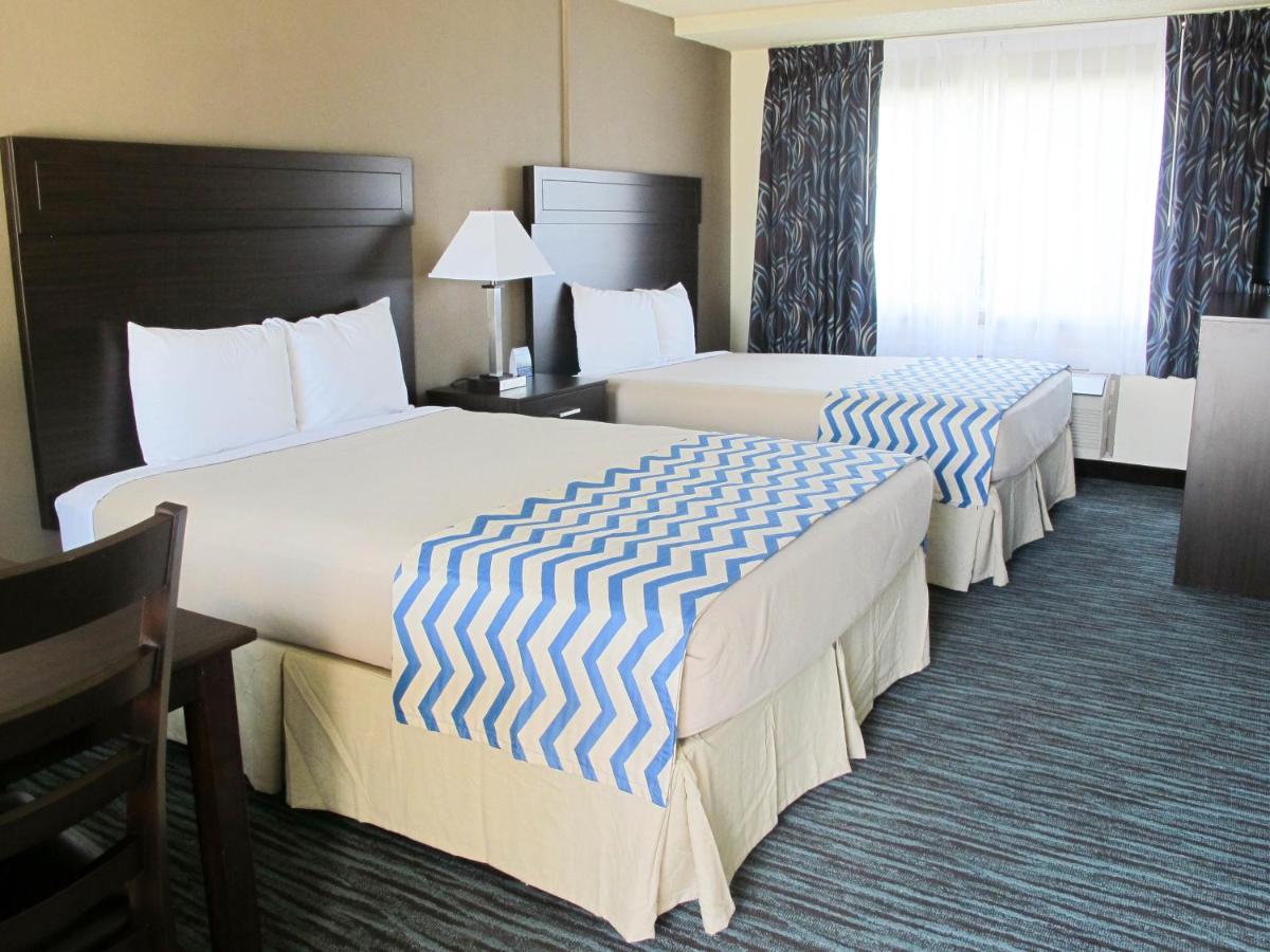 Queen Room with Two Queen Beds - Non-Smoking at Travelodge by Wyndham Aberdeen