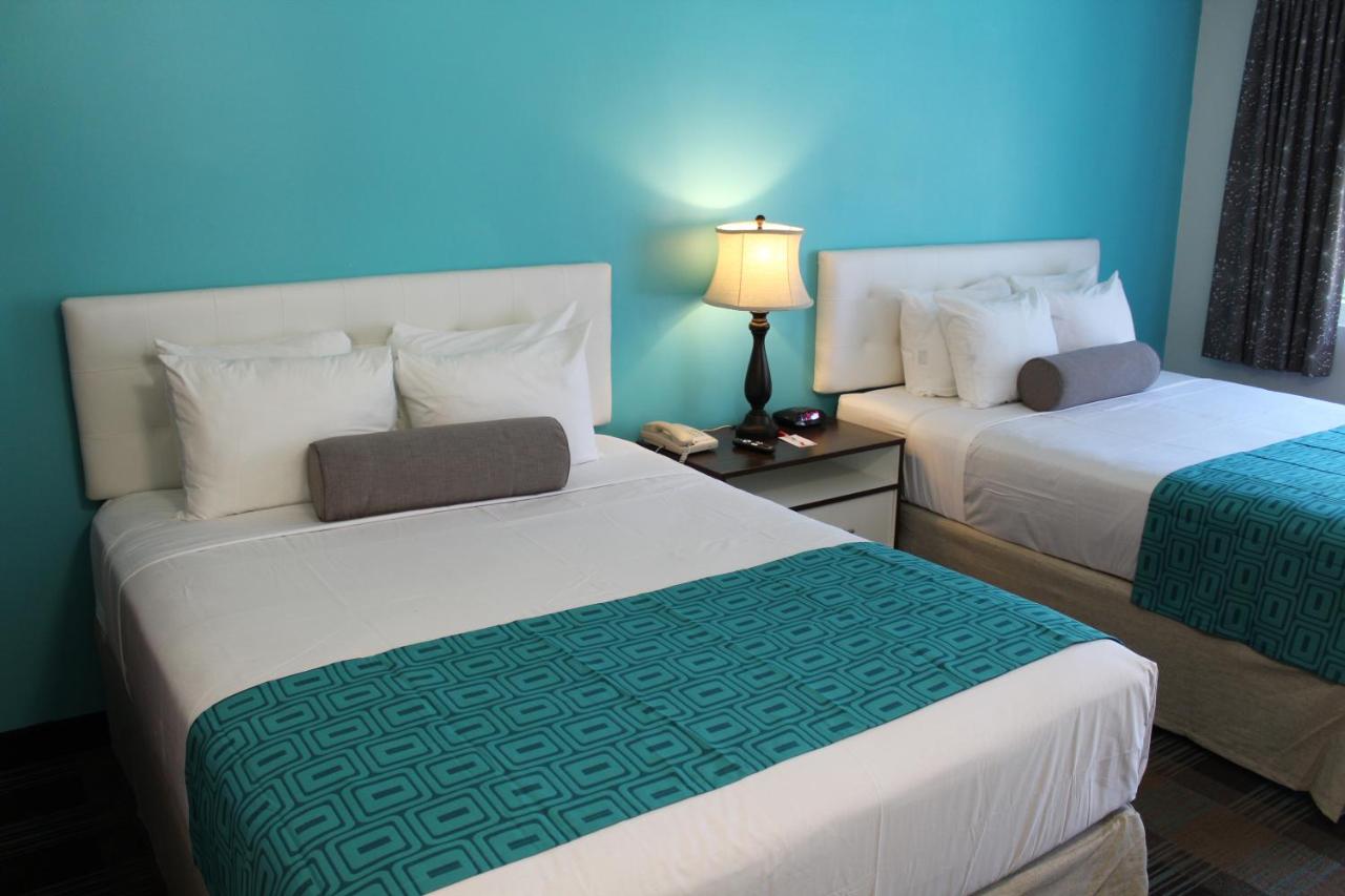 Queen Room with Two Queen Beds at Howard Johnson by Wyndham San Diego Hotel Circle