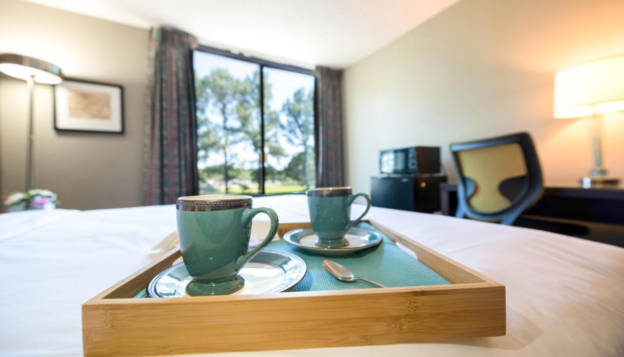 King Room with Two King Beds - Non-Smoking at Travelodge by Wyndham Memphis Airport/Graceland