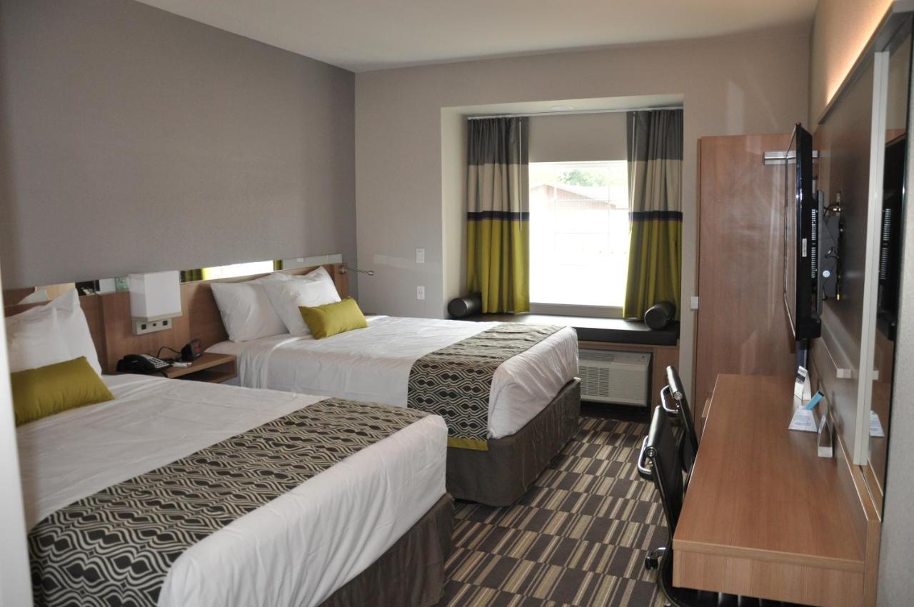 Queen Room with Two Queen Beds at Microtel Inn & Suites by Wyndham Lubbock
