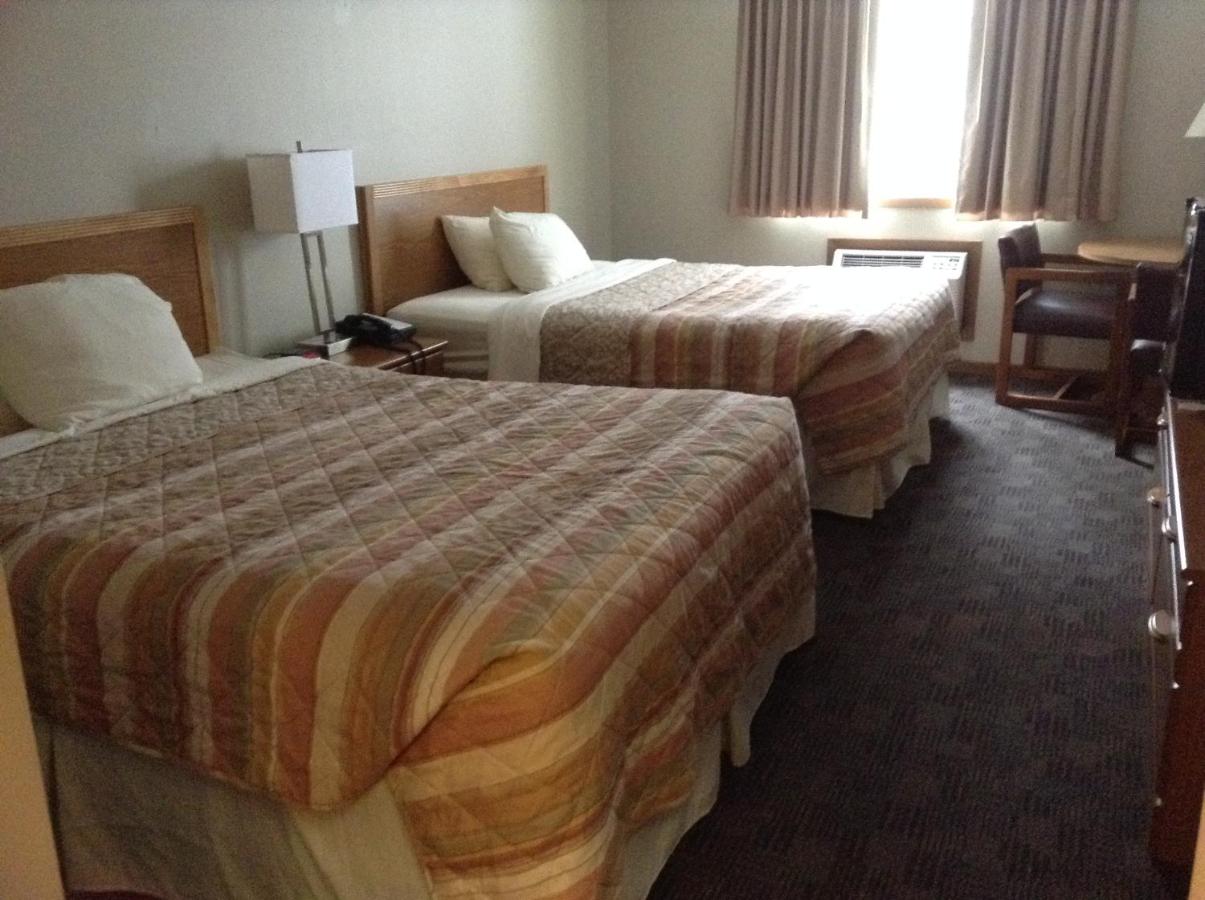 Queen Room with Two Queen Beds at SunRise Inn Hotel