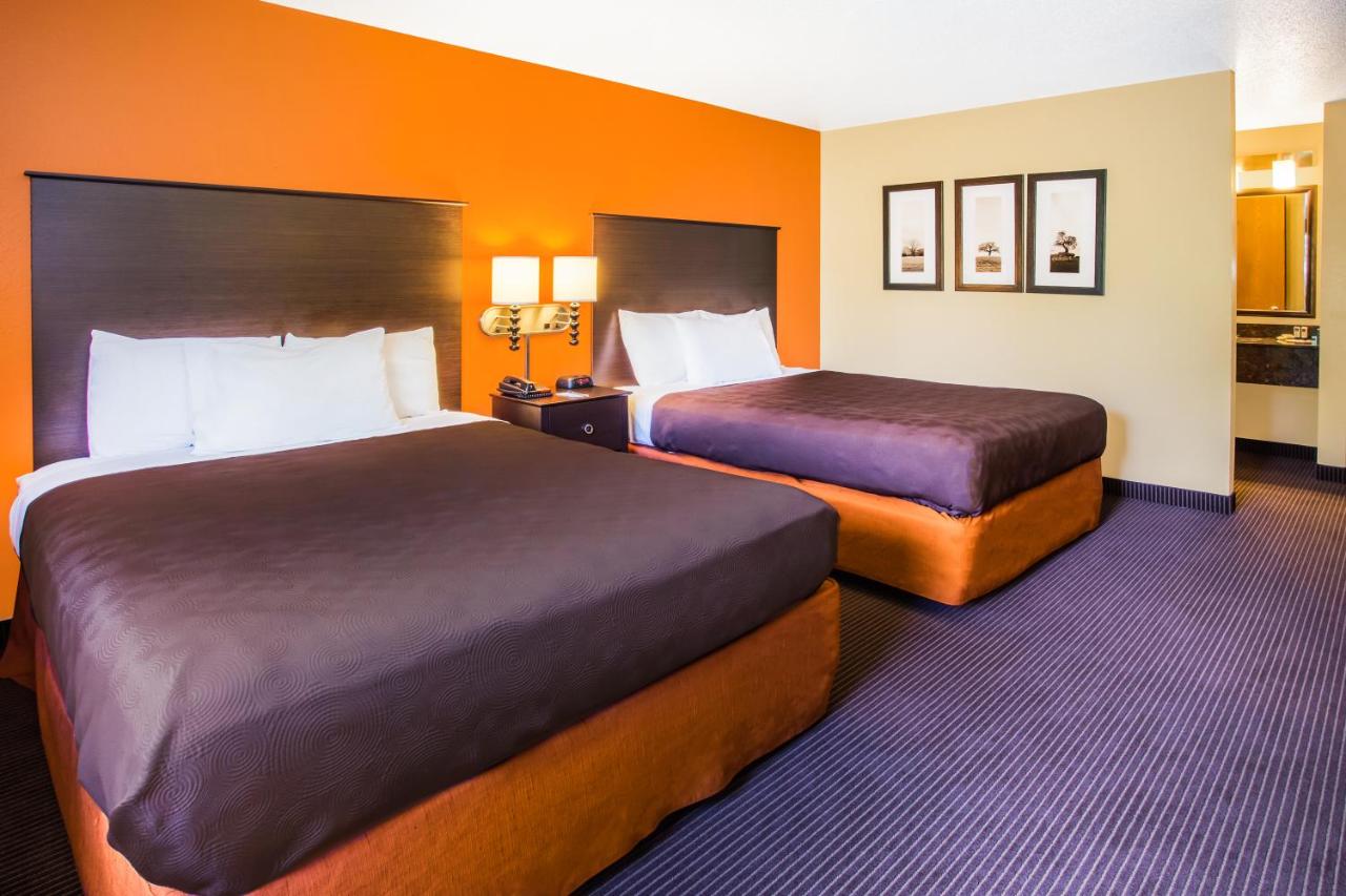 Queen Room with Two Queen Beds - Non-Smoking at AmericInn by Wyndham Menomonie