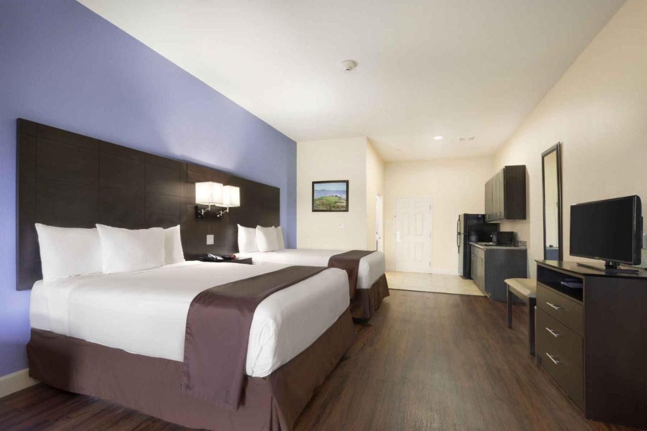 Queen Room with Two Queen Beds - Non-Smoking at Days Inn & Suites by Wyndham Galveston West/Seawall