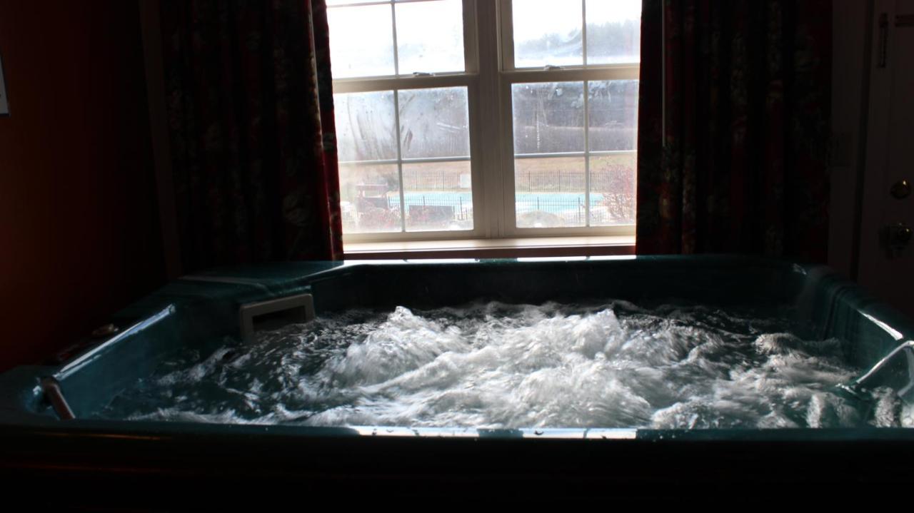 1 King Bed with Sofa Bed, Fireplace, and Hot-Tub at Swiss Chalets Village Inn