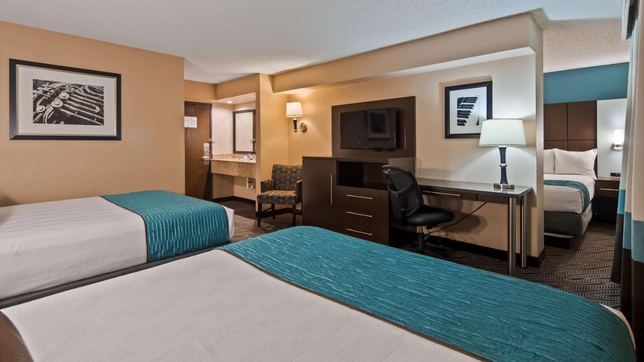 Family Room with Two Queen Beds and Single Bed at Best Western Plus Galleria Inn & Suites