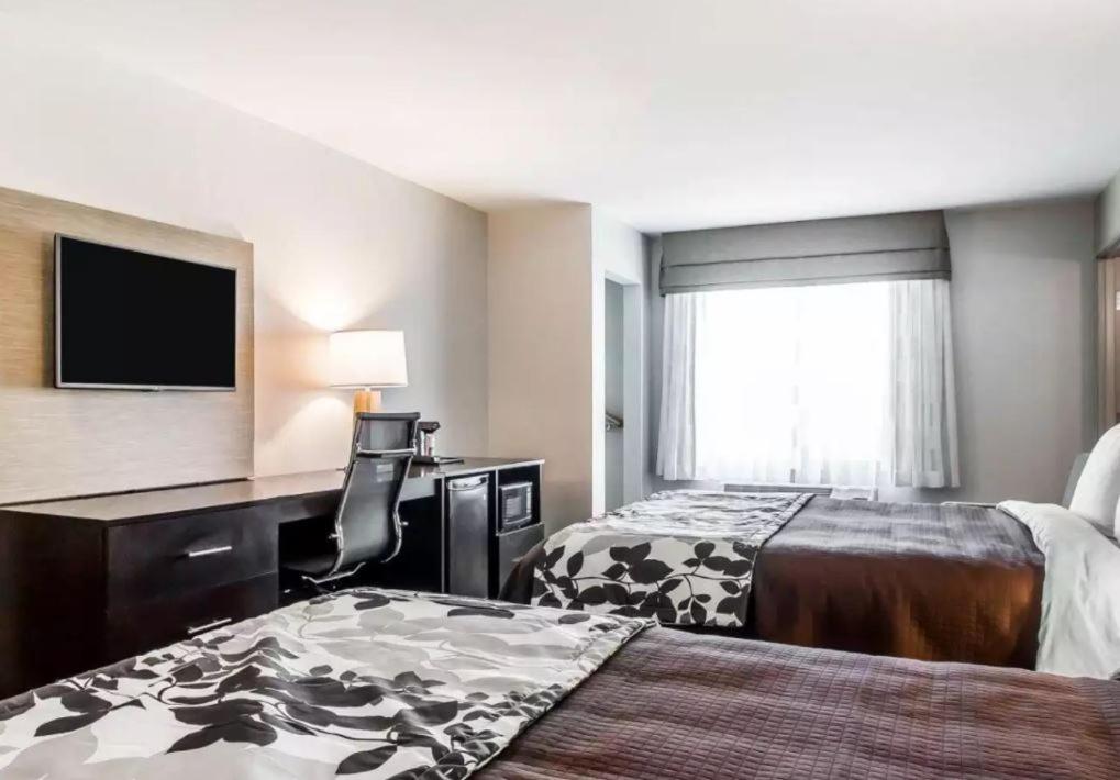 Standard Queen Room with Two Queen Beds at Sleep Inn & Suites Hannibal West