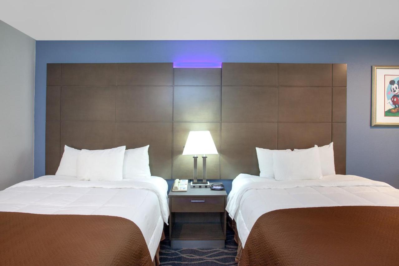 Queen Room with Two Queen Beds and Bath Tub - Mobility Accessible/Non-Smoking at Travelodge Inn & Suites by Wyndham Anaheim on Disneyland Dr