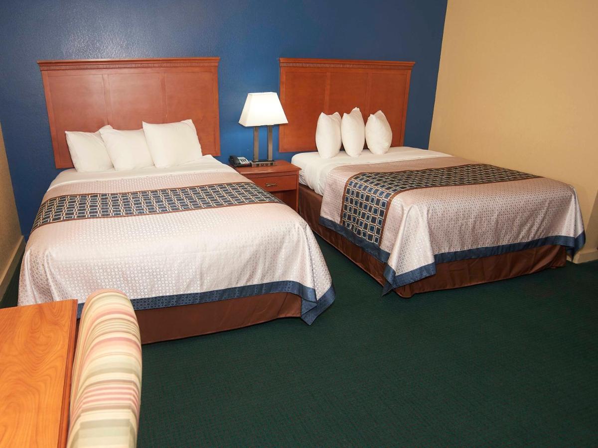 Two Queen Beds with Fire Place and Spa Bath at Swiss Chalets Village Inn