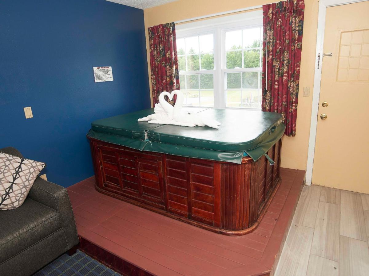 1 King Bed with Sofa Bed, Fireplace, and Hot-Tub at Swiss Chalets Village Inn