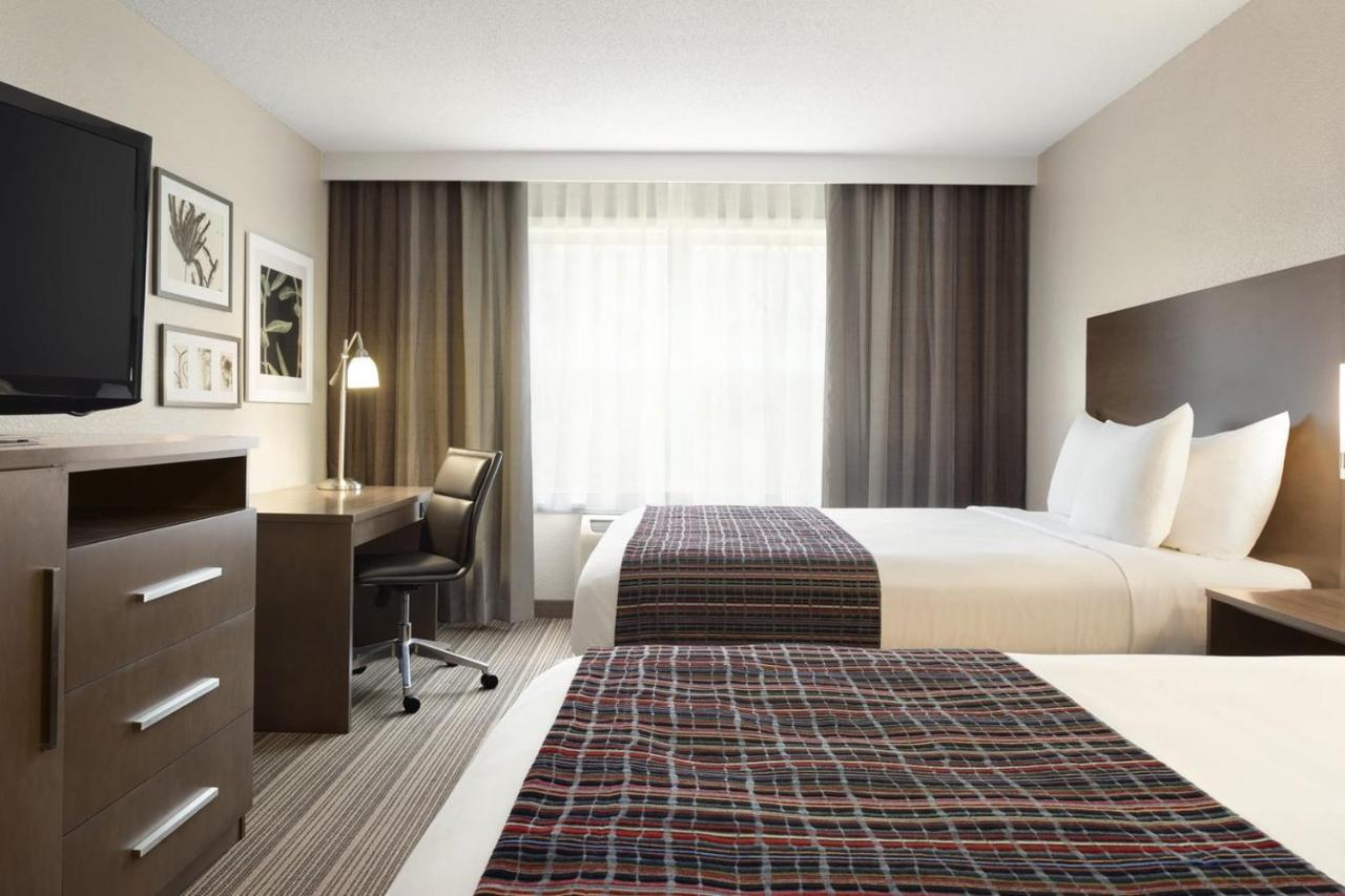 Queen Room with Two Queen Beds at Country Inn & Suites by Radisson, Platteville, WI