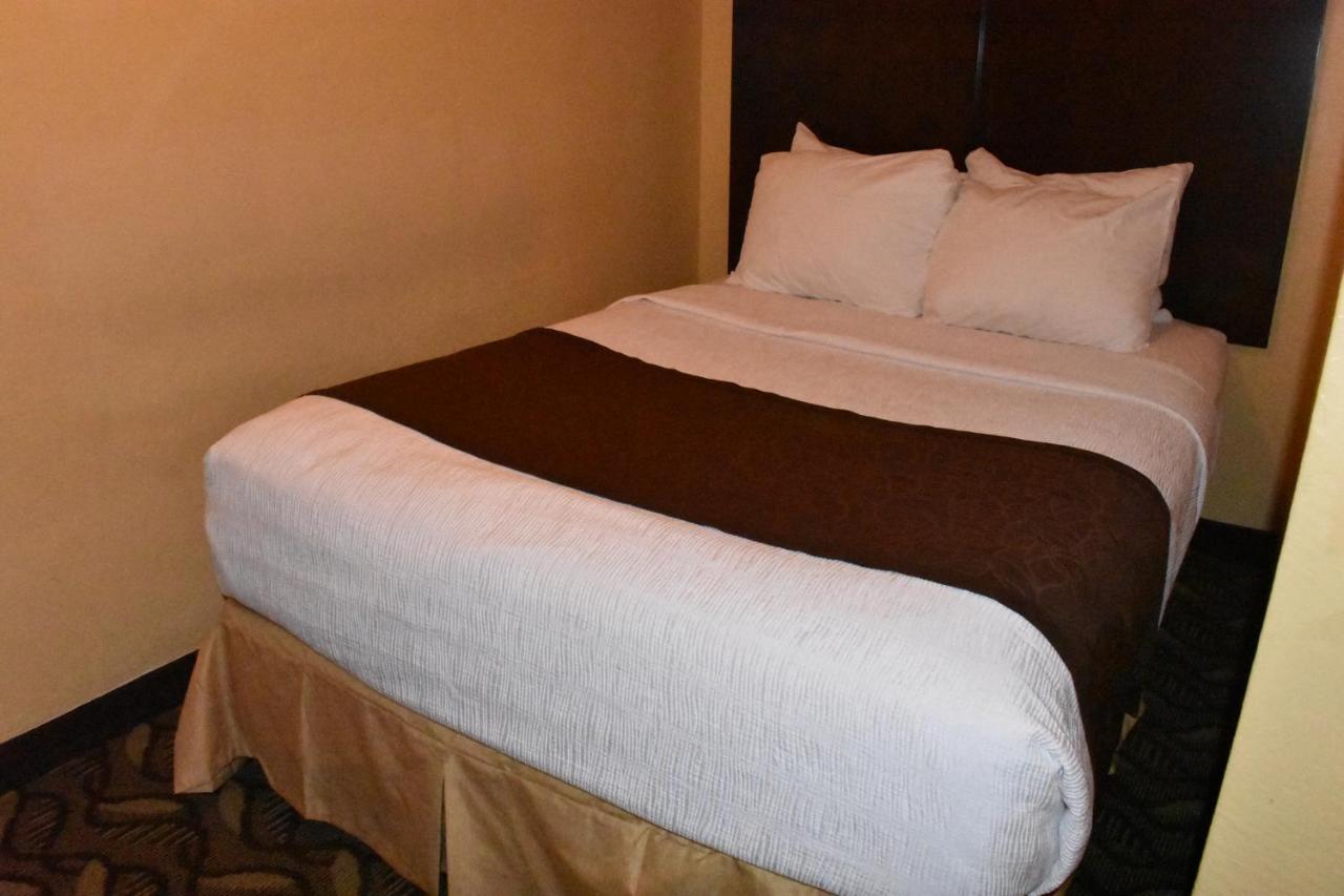 Queen Room with Two Queen Beds and One Double Bed - Non-Smoking at Best Western Durango Inn & Suites