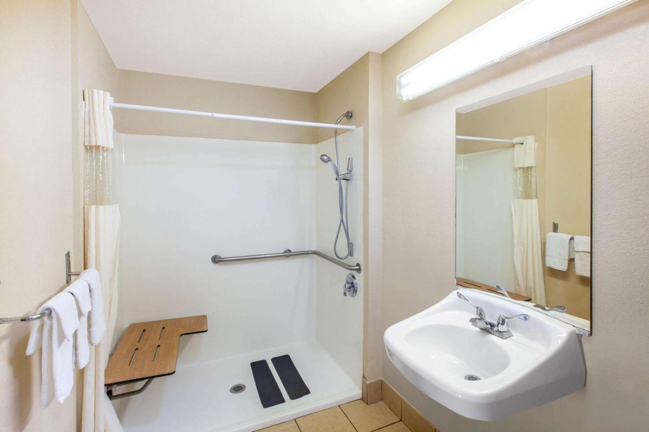 Double Room with Two Double Beds and Roll-In Shower - Mobility Access/Non-Smoking at Days Inn & Suites by Wyndham Braunig Lake